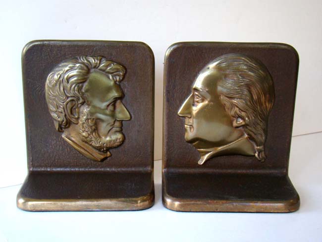 A fine pair of solid bronze Presidential Bookends circa 1930 with the profiles of Abraham Lincoln and George Washington.